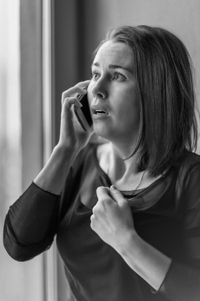Worried woman on phone