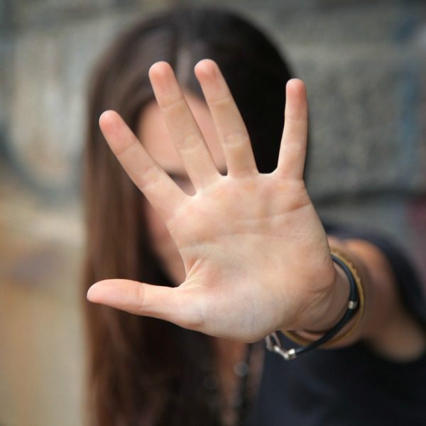 Woman in denial with hand over face