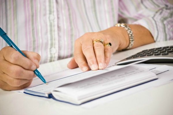 Woman writing check