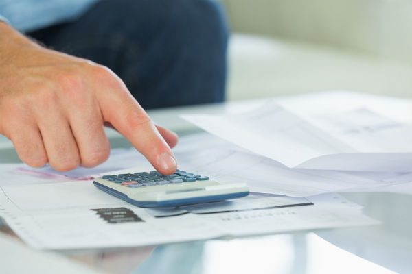Man using calculator