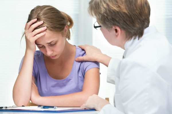 Distraught woman with counselor