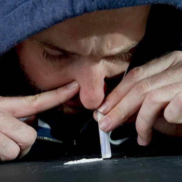 Man snorting cocaine