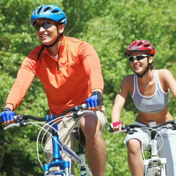 Man and woman bicycling