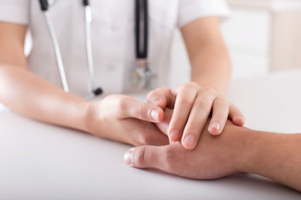 Nurse comforting patient