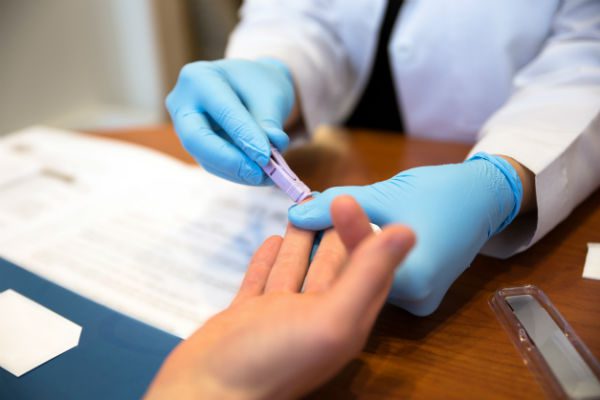 Nurse taking blood sample