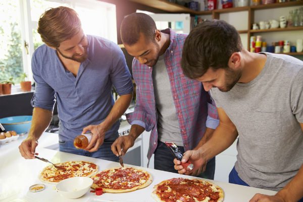Sober living friends making piza