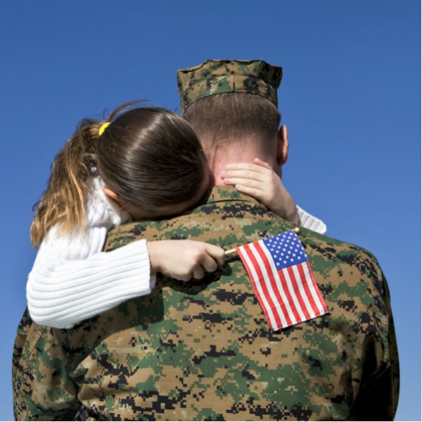 Soldier hugging daughter