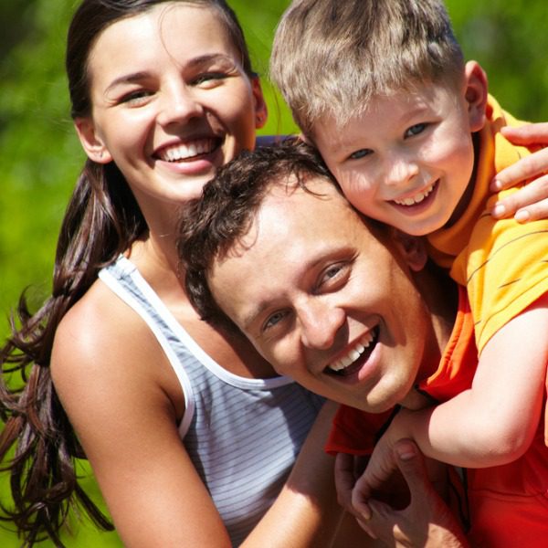 Young family hugging