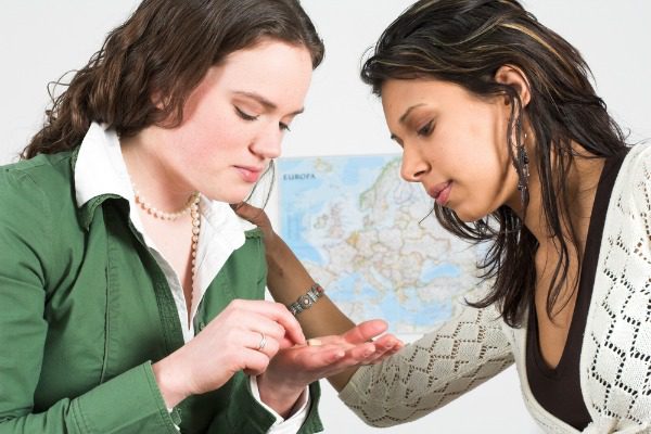 Women sharing pills