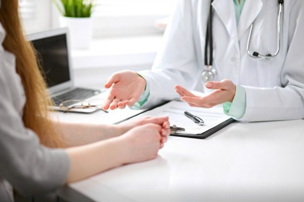 Patient consulting with doctor
