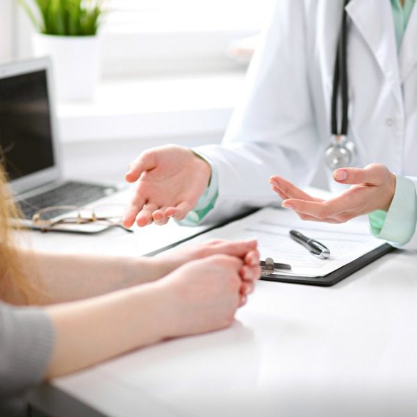 Doctor talking with patient