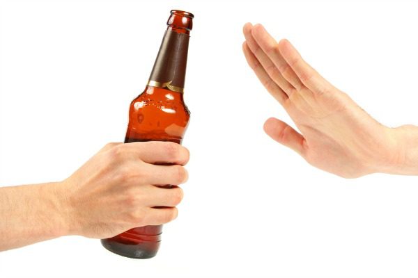 Hand refusing a beer