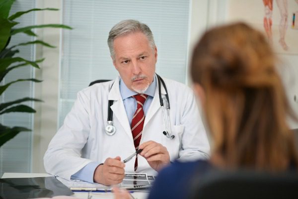 Doctor talking with patient