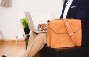 job interview brief case after recovery typing on computer