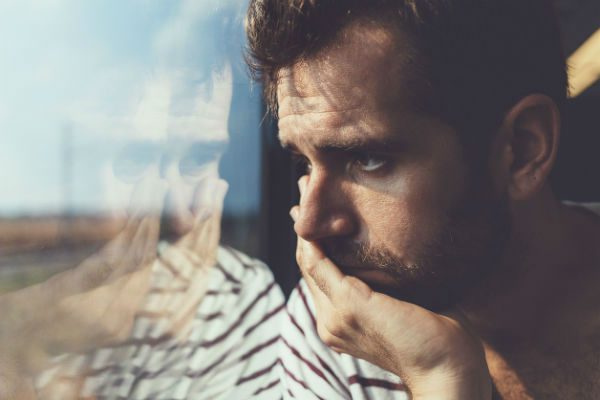 Mindful man by window