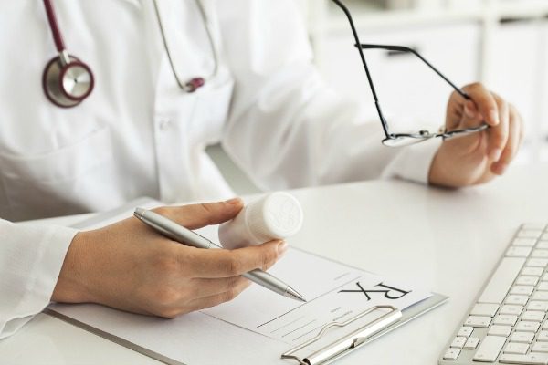Doctor writing prescription