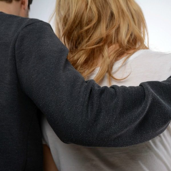Man comforting wife