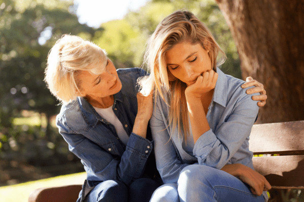 Woman comforting daughter
