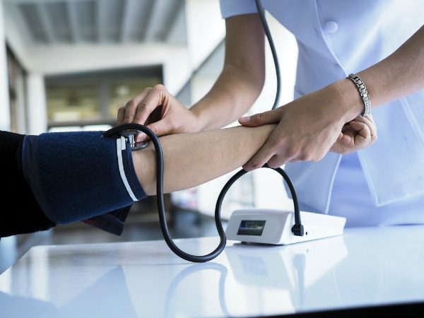 Nurse taking blood pressure