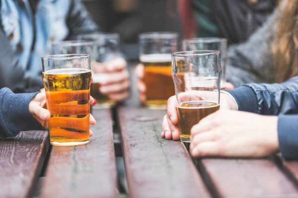 Drinking beer on picnic table