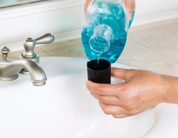 Pouring mouthwash