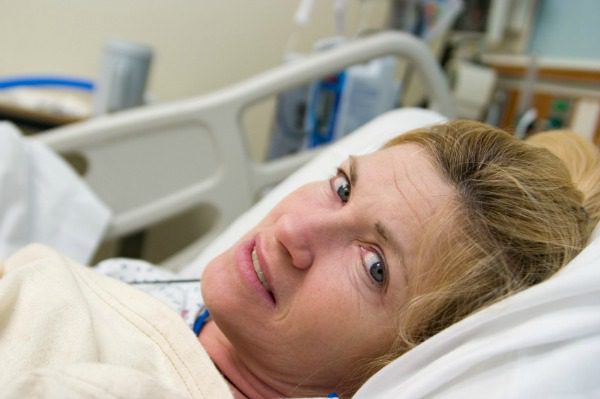 Woman in hospital bed