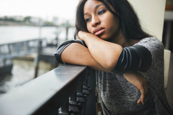 Black woman on balcony