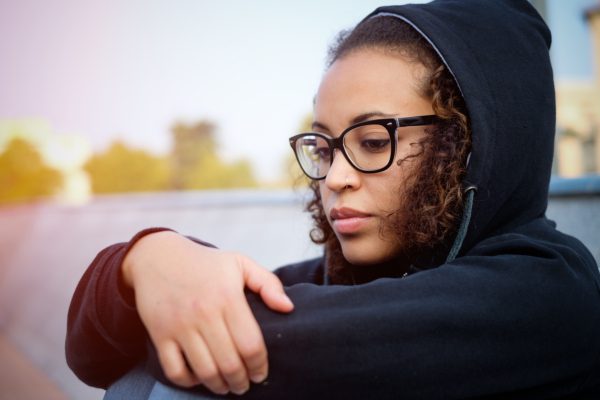 Sad young woman sitting
