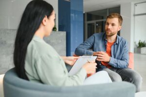 a man is being admitted to an alcohol detox center