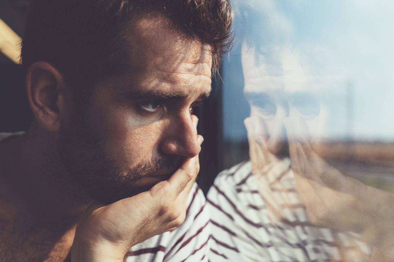 Man alone by window