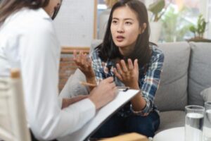 a woman works on recovery in a dialectical behavior therapy program
