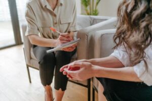 a woman works through issues in a fentanyl addiction treatment program