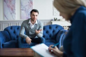 a man works through issues in an individual therapy program