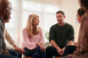 people talk about issues in addiction therapy programs