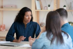 a woman discusses options in a xanax addiction treatment program