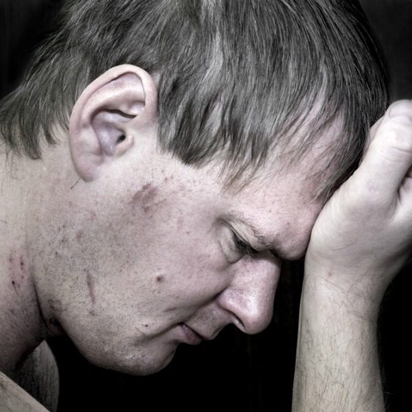 Addicted man thinking of treatment
