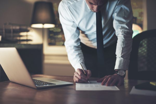 Lawyer signing a contract