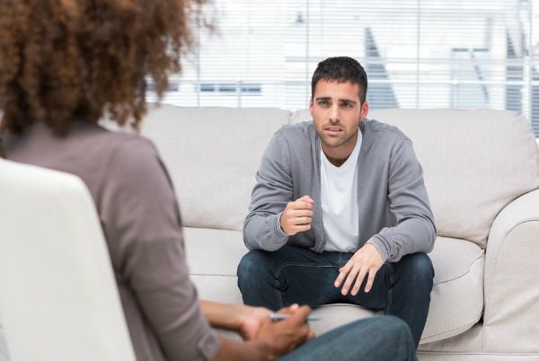 Man talking to counselor