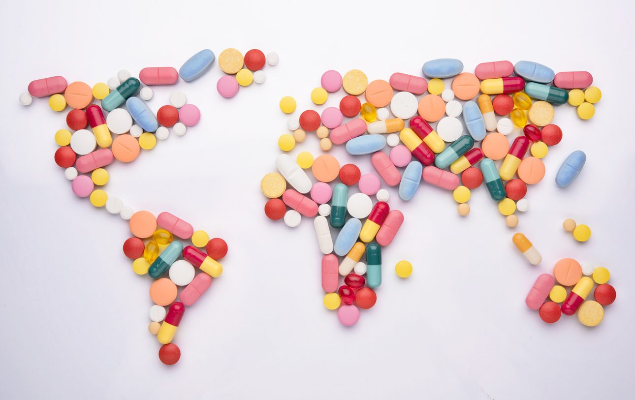 pills arranged into the shape of a world map