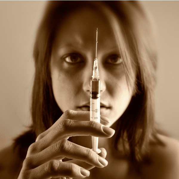 Woman with heroin needle