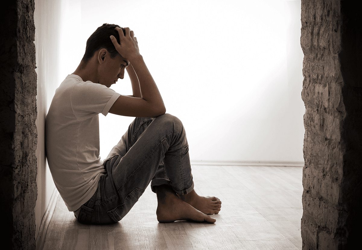 A man wondering, "What are the side effects of long-term marijuana use?