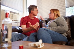 Couple Arguing On Sofa about drug abuse